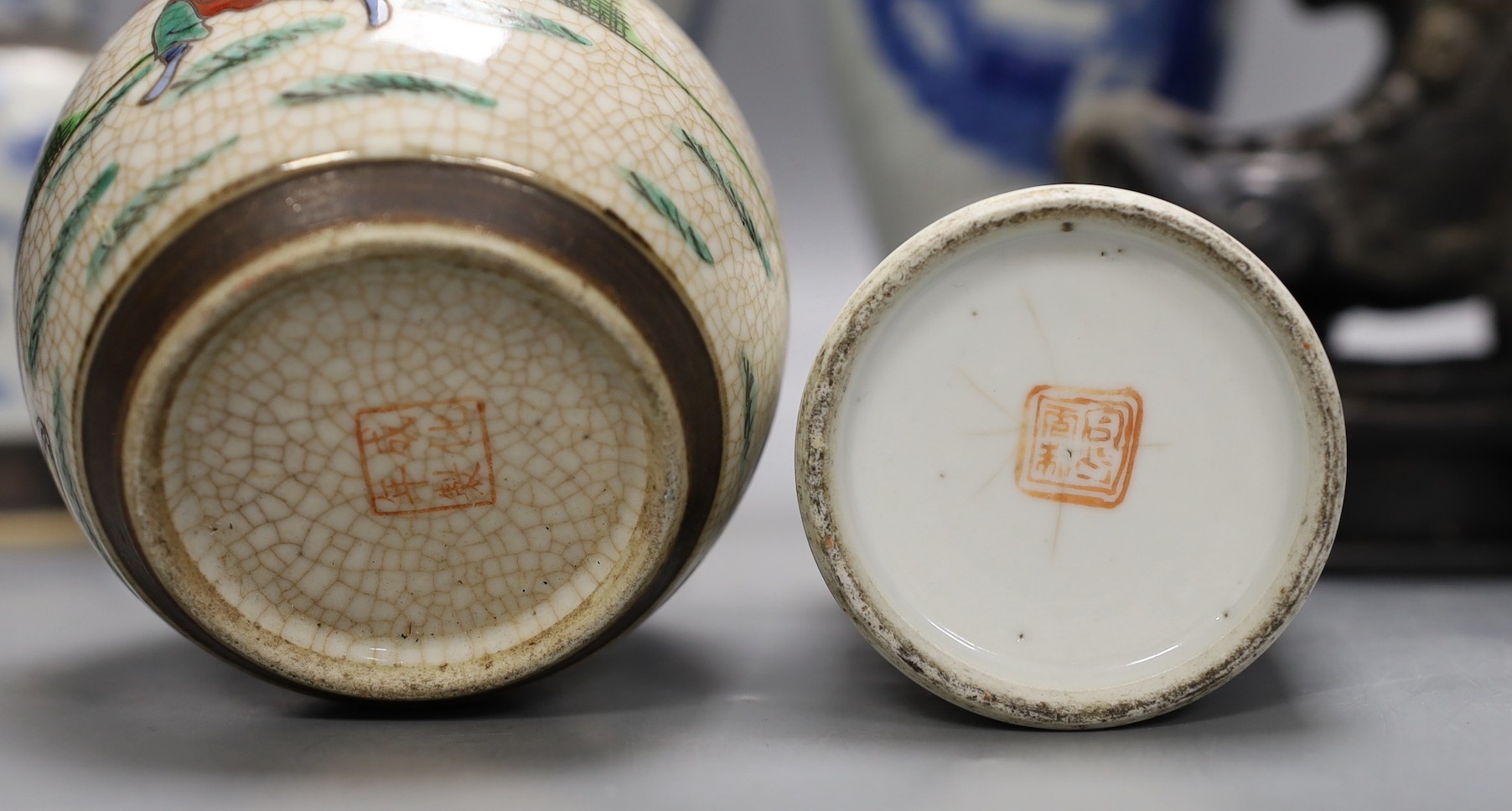 Three Chinese blue and white crackle glaze vases, a famille rose brush pot, late 19th/early 20th century, a crackle glaze ginger jar and a carved soapstone lion-dog (6)